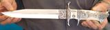 Integral knife forged by Edmund Davidson,with scrimshaw by Linda Karst Stone and engraving by Jere Davidson.  The knife was a gift given to Richard Petty from his family.